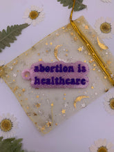 Load image into Gallery viewer, Abortion is healthcare keychains
