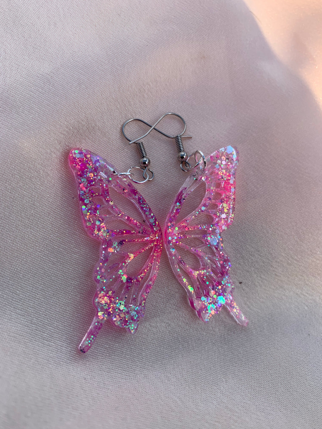 Pink iridescent butterfly wing earring
