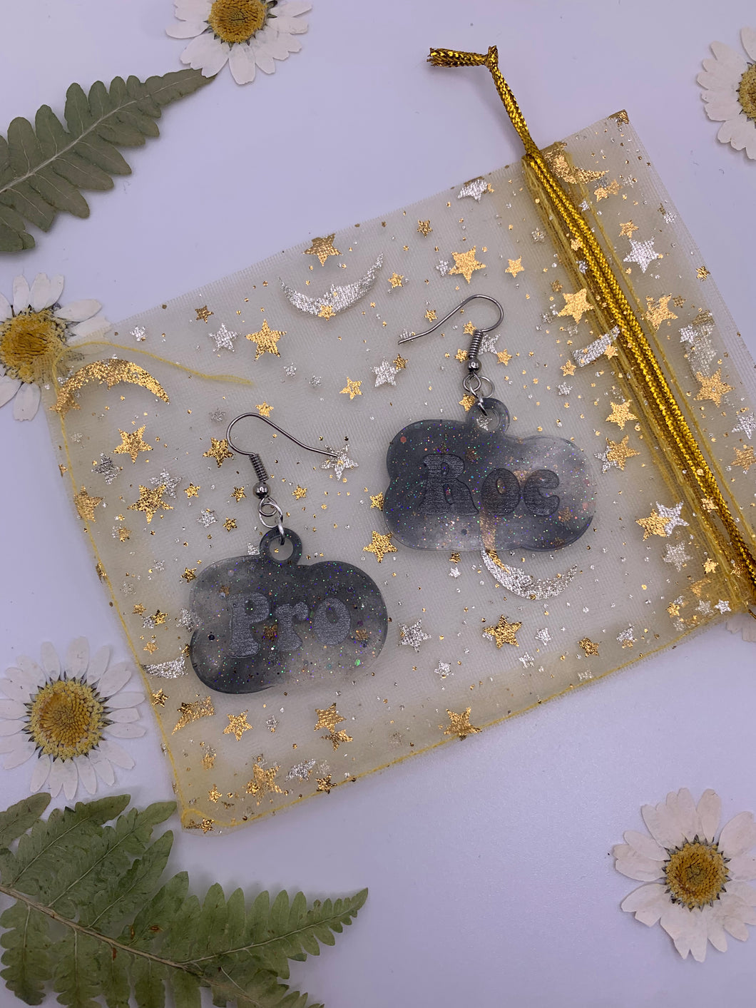 Black and white pro roe earrings