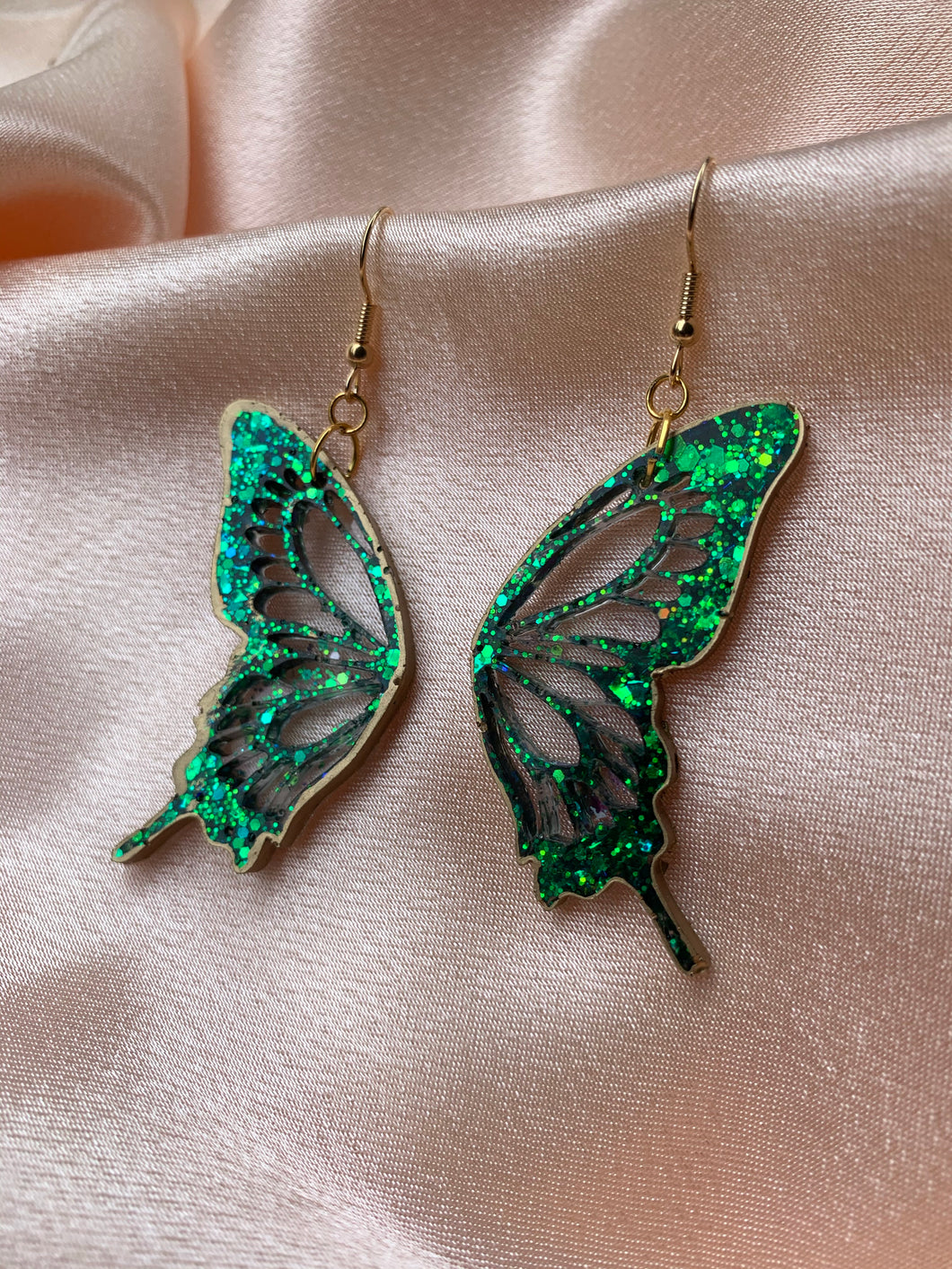 Dark green butterfly wing earrings lined in gold