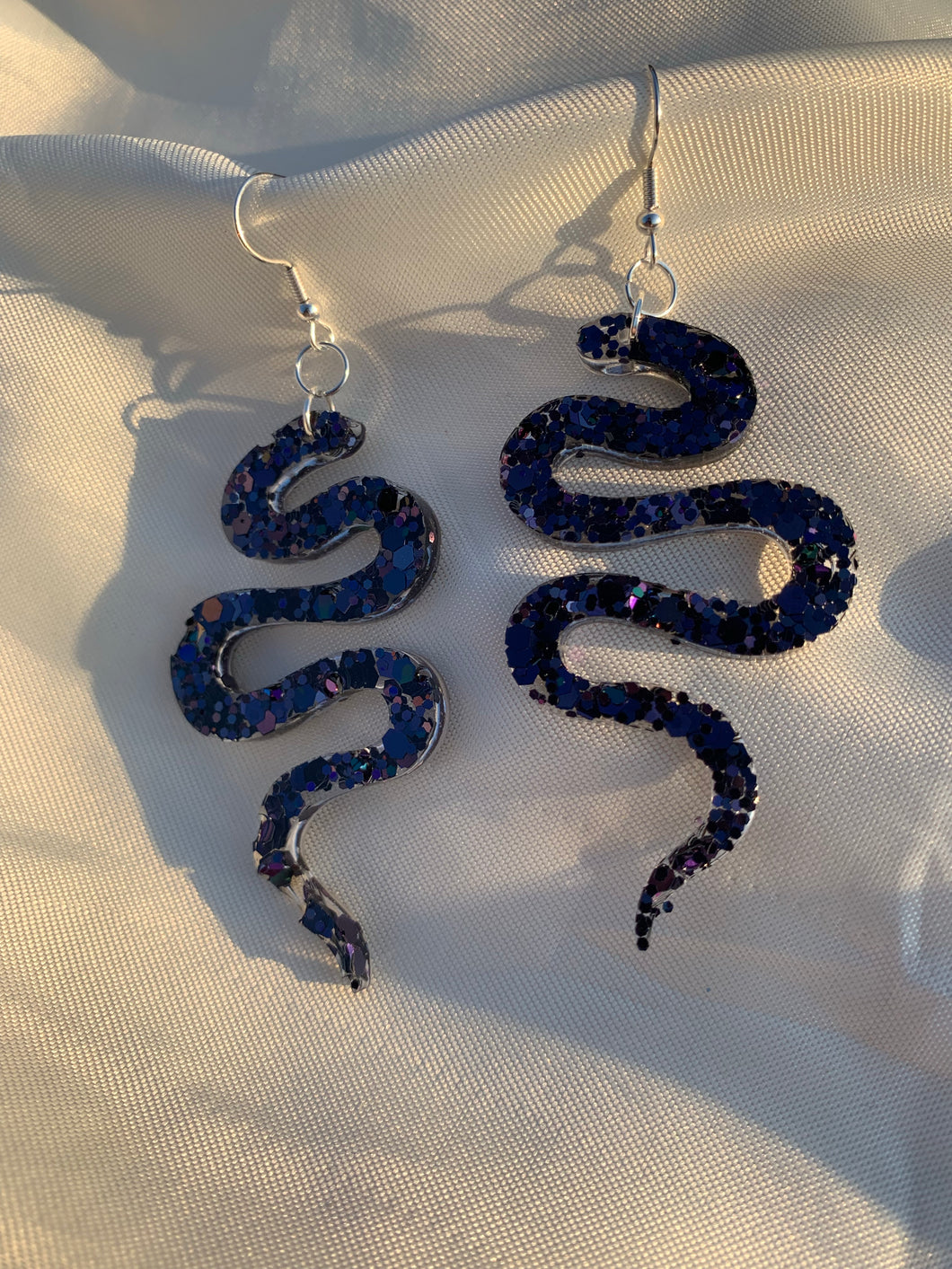 Black glitter snake earrings