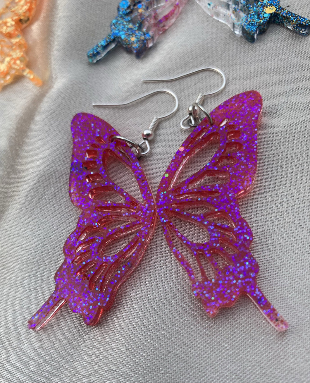 Magenta iridescent butterfly wing earrings