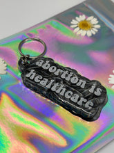 Load image into Gallery viewer, Sliver velvet holographic AIHC keychain
