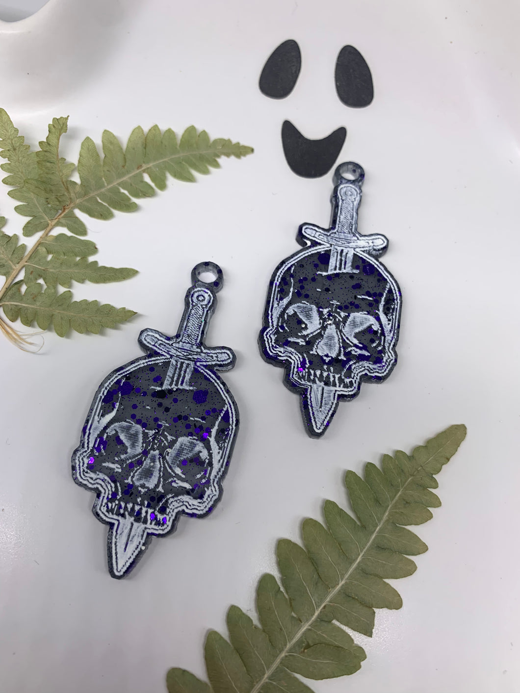 Purple and black skull dagger earrings