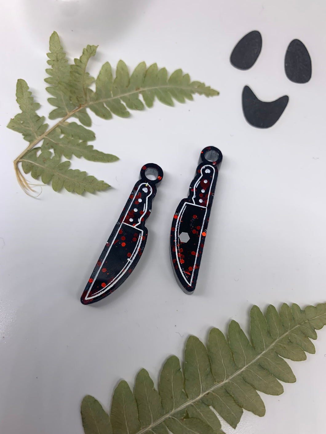 Red and black knife earrings