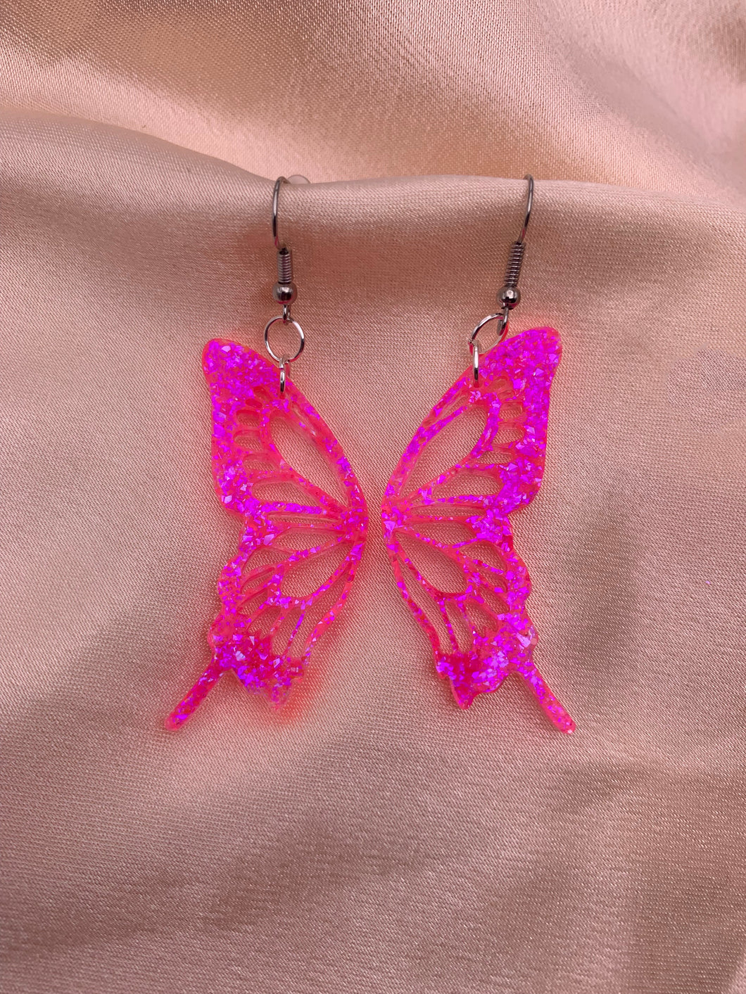 Neon pink butterfly wing earrings