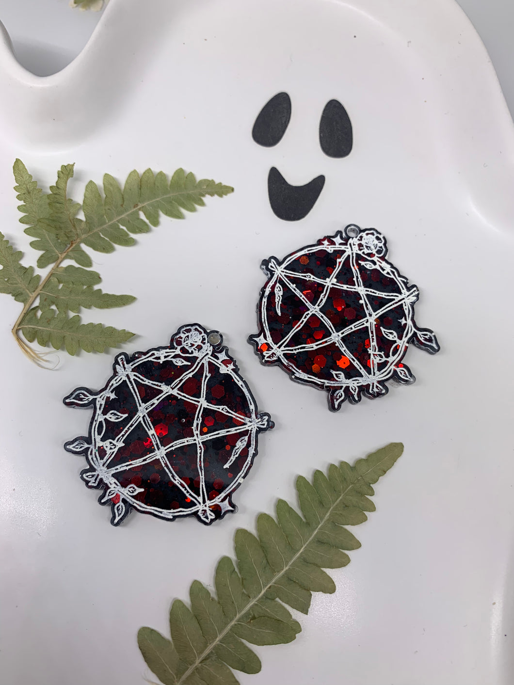 Red and black pentagram earrings