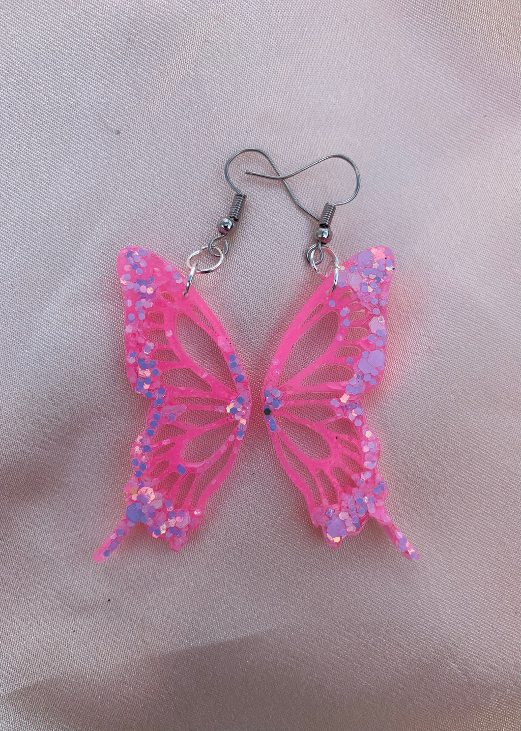 Pink glow in the dark butterfly wing earring
