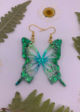 Load image into Gallery viewer, Green and blue glow in the dark butterfly wing earrings
