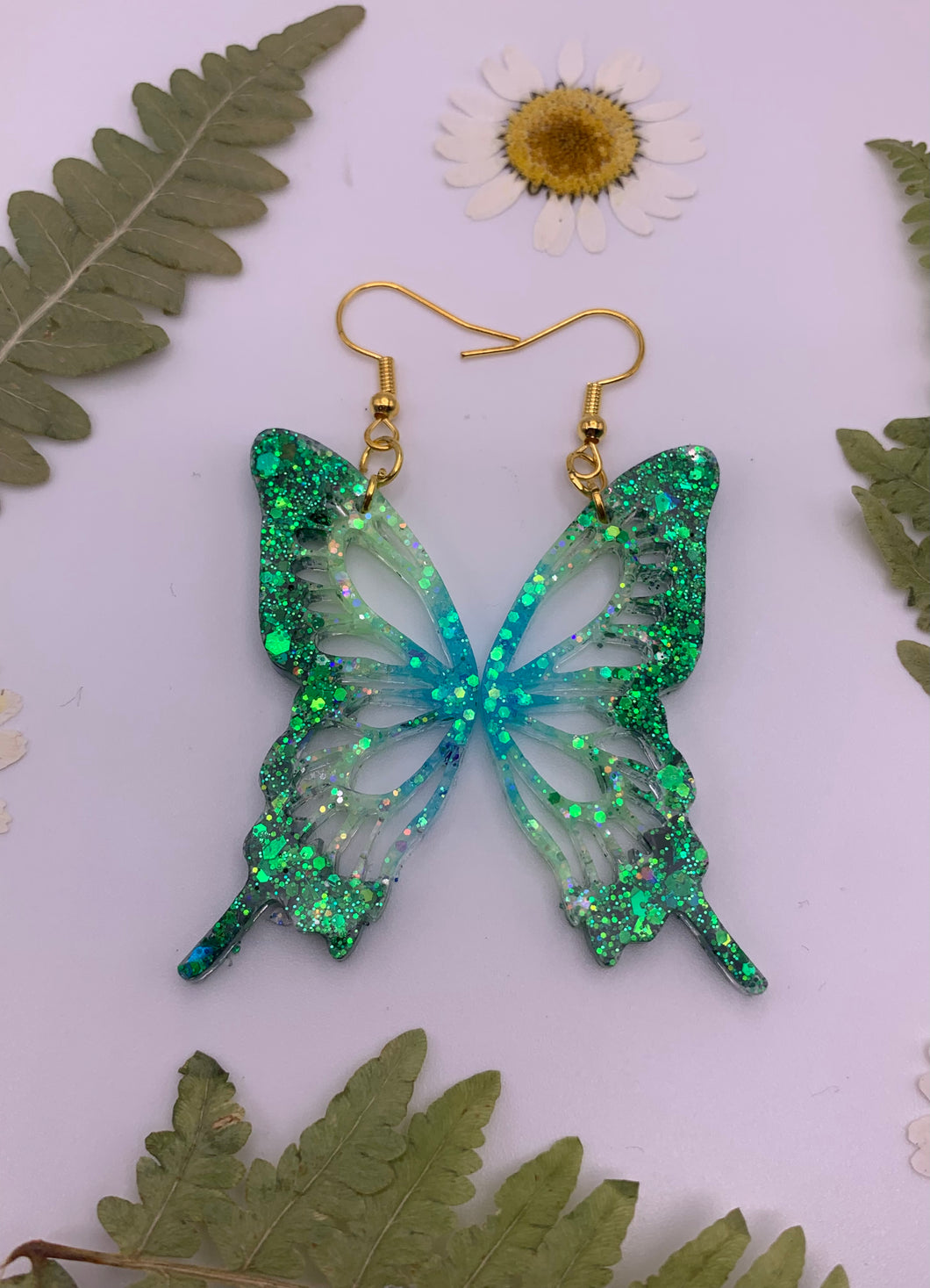 Green and blue glow in the dark butterfly wing earrings