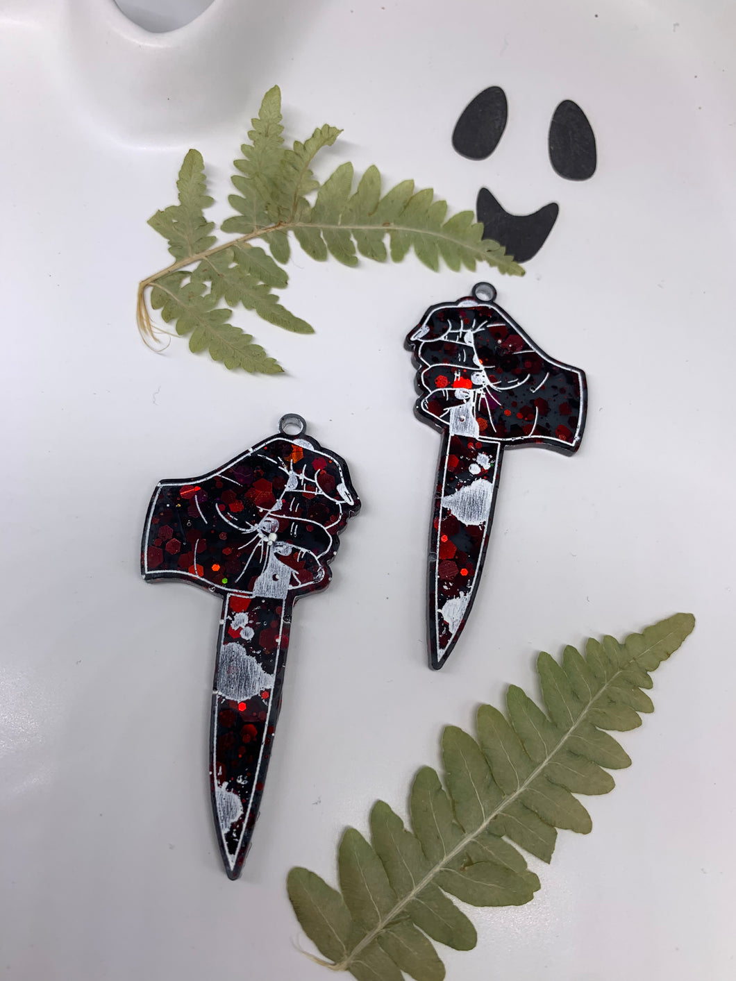 Red and black dagger hand earrings