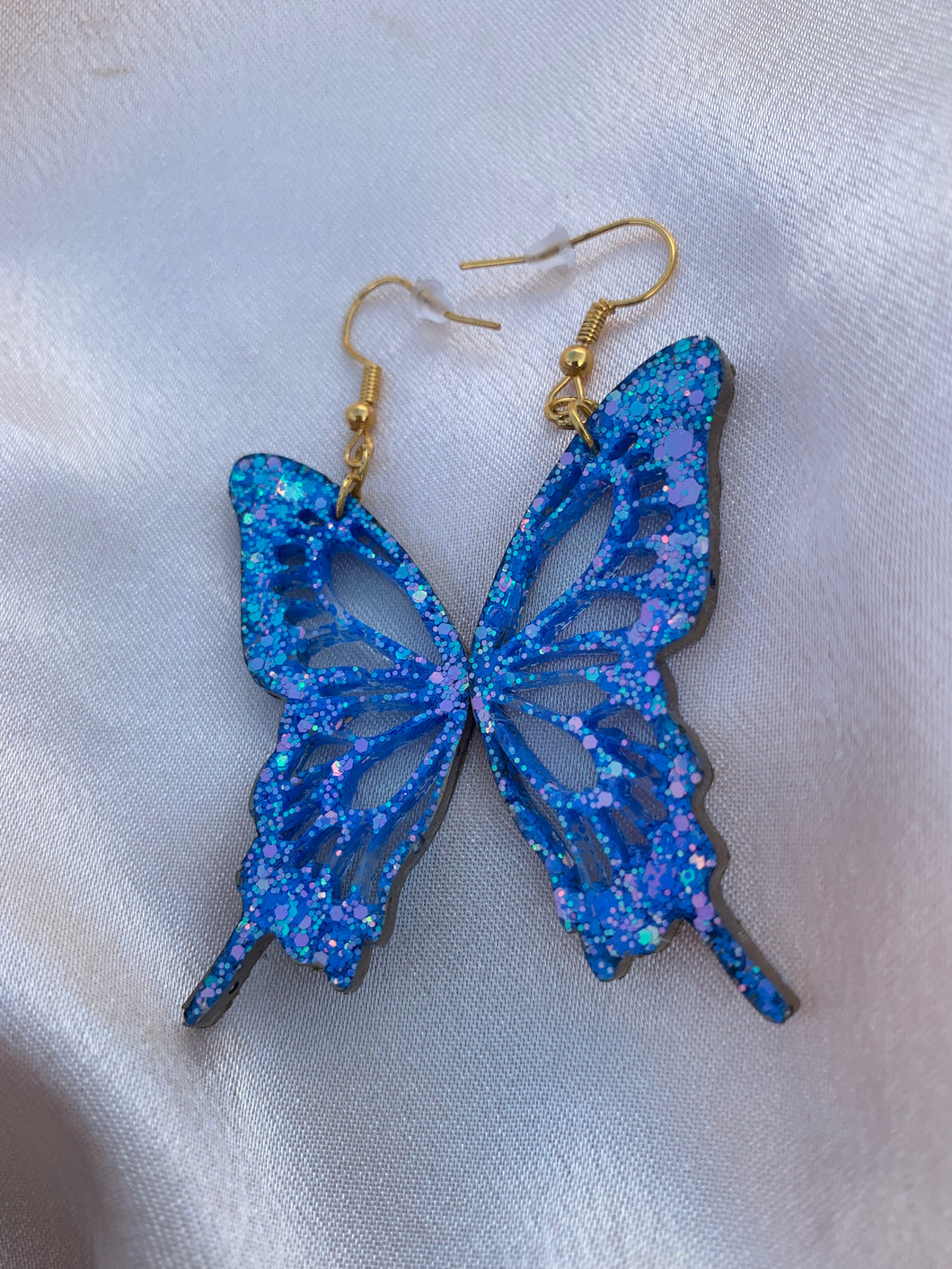 Blue butterfly wing earrings lined with gold