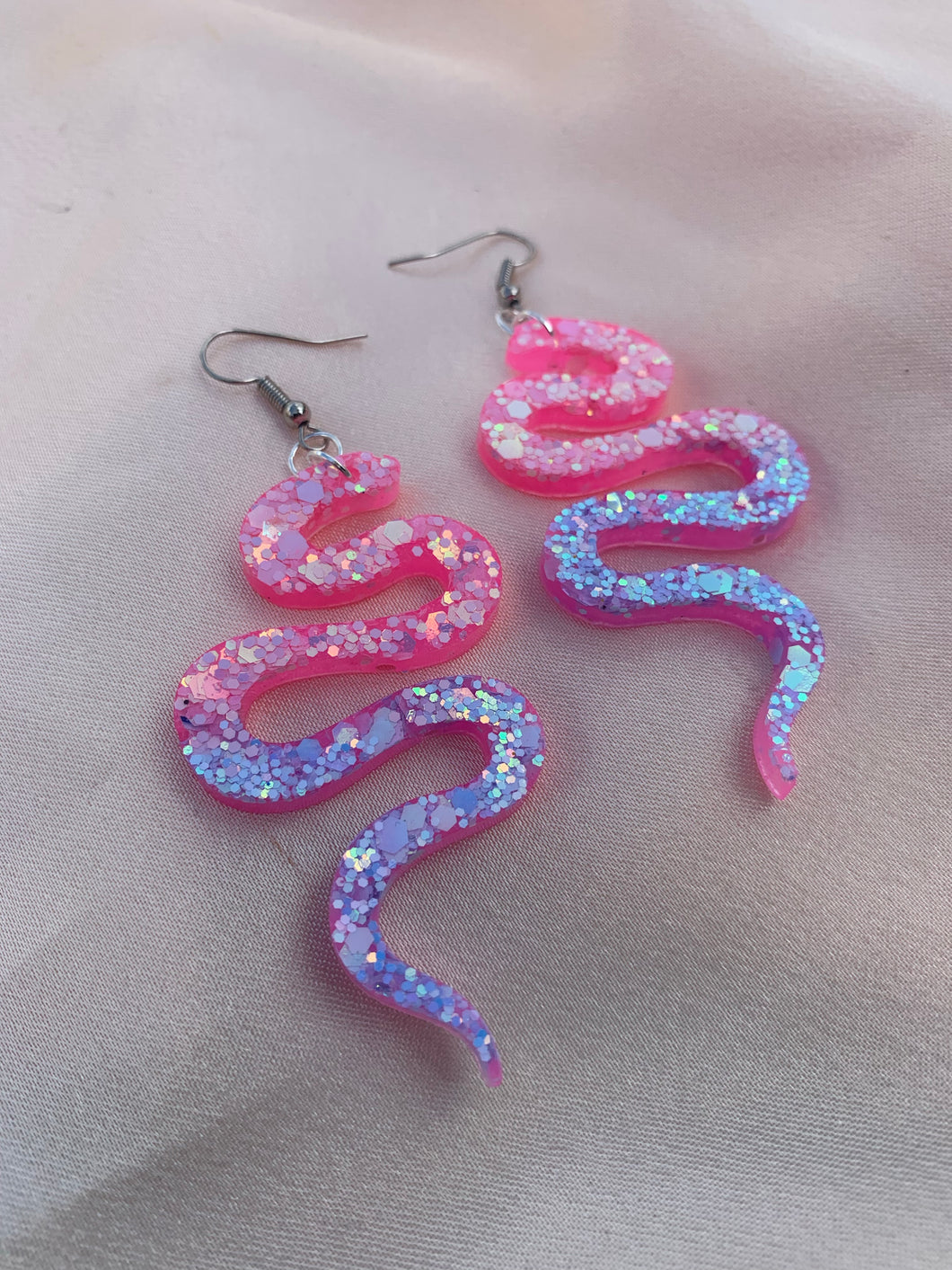 Pink and blue glitter snake earrings
