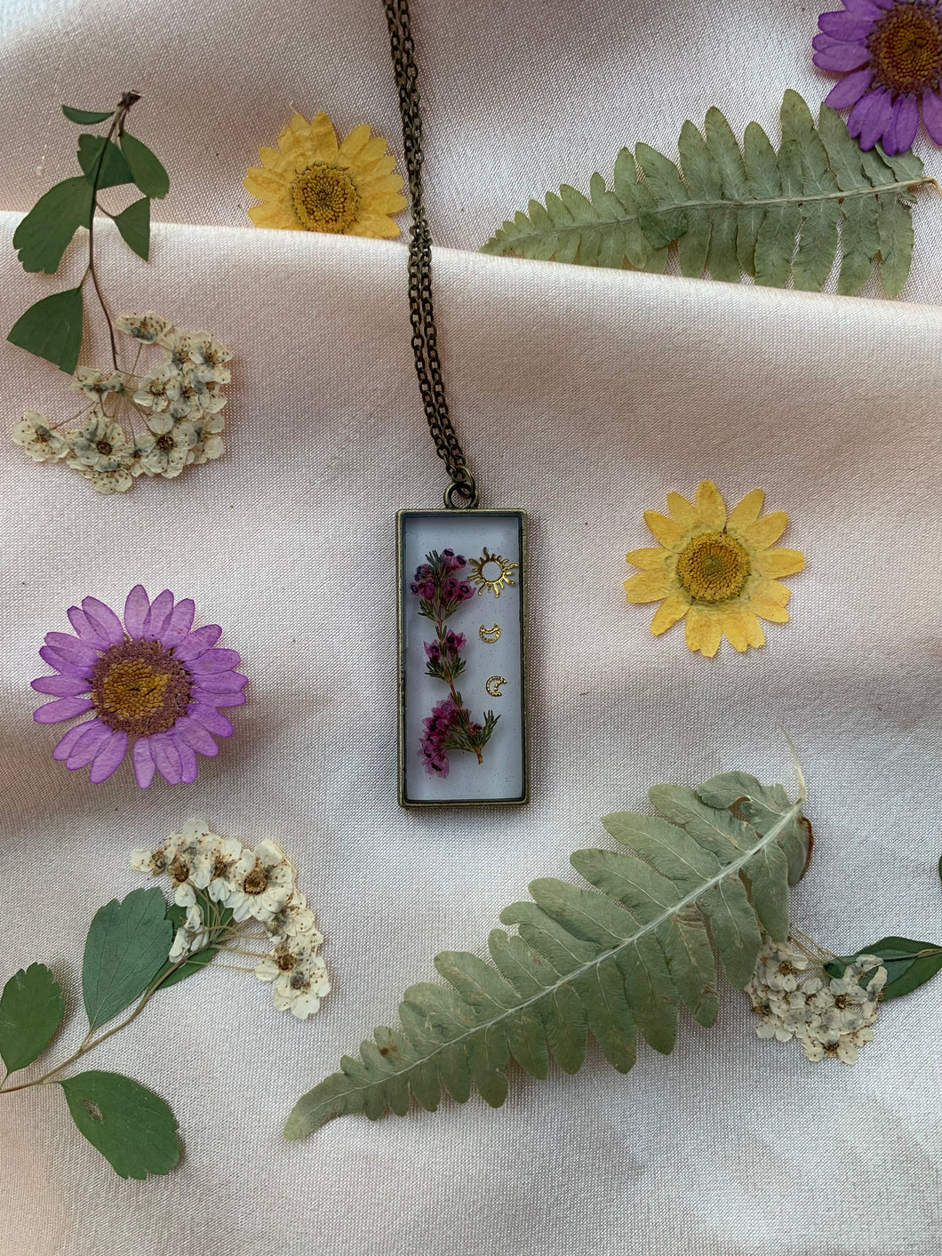 Bronze white background flower necklaces