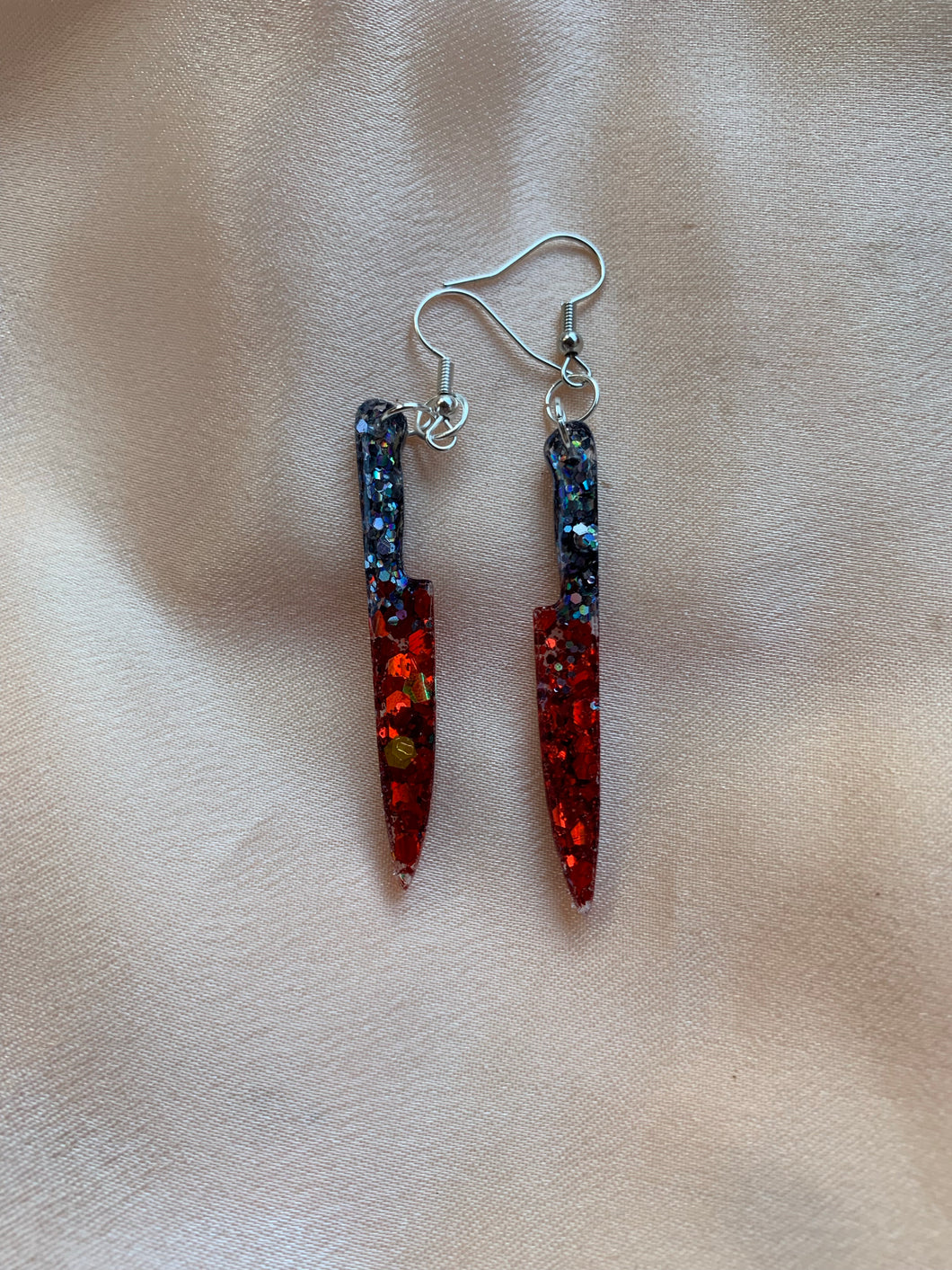 Red knife earrings