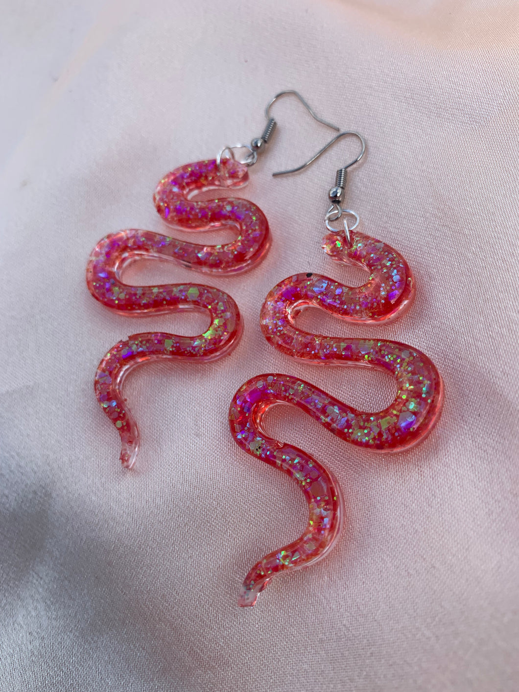 Red iridescent snake earrings