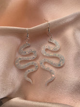 Load image into Gallery viewer, White iridescent snake earrings
