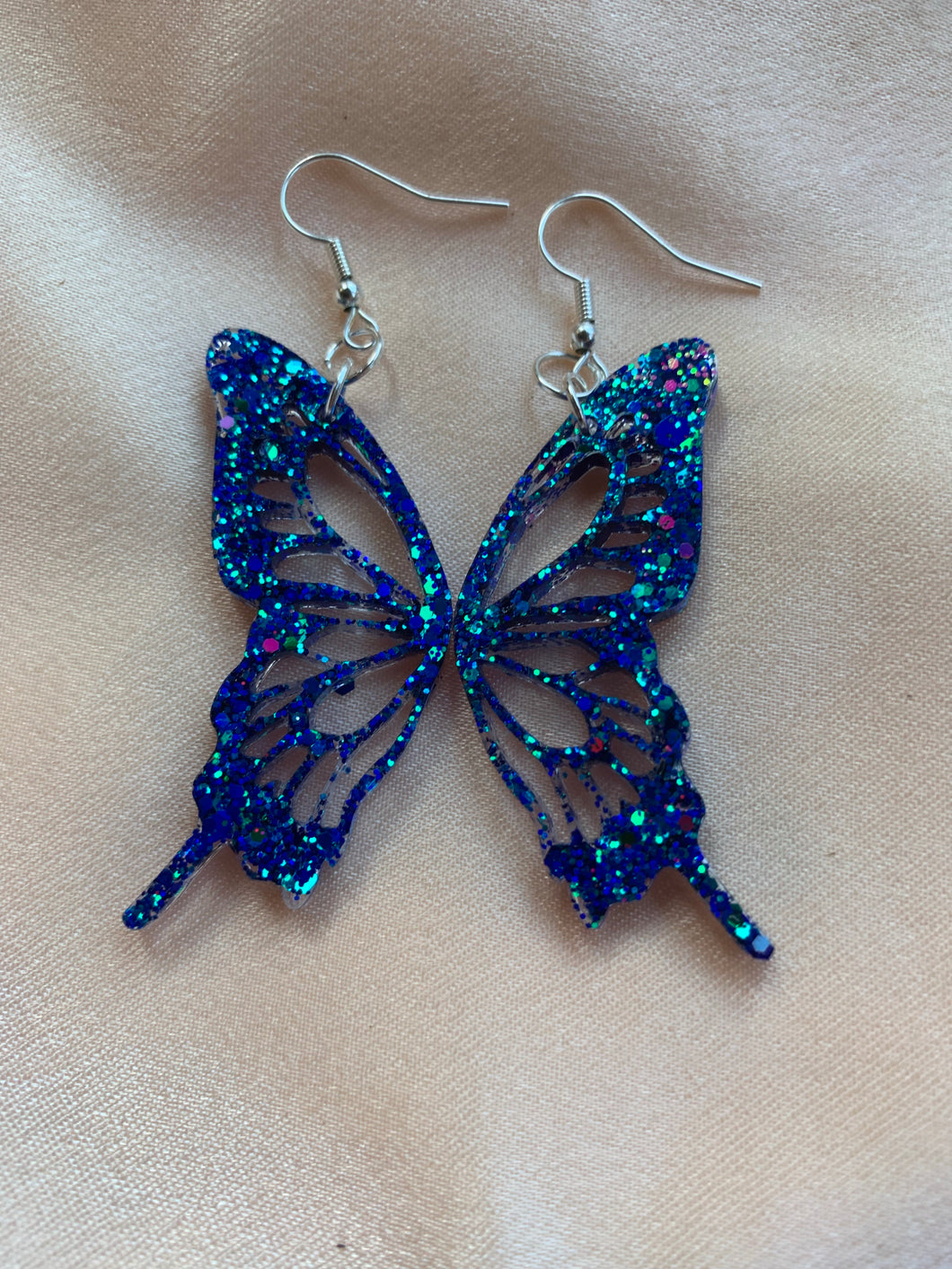 Bright blue glow butterfly wing earrings