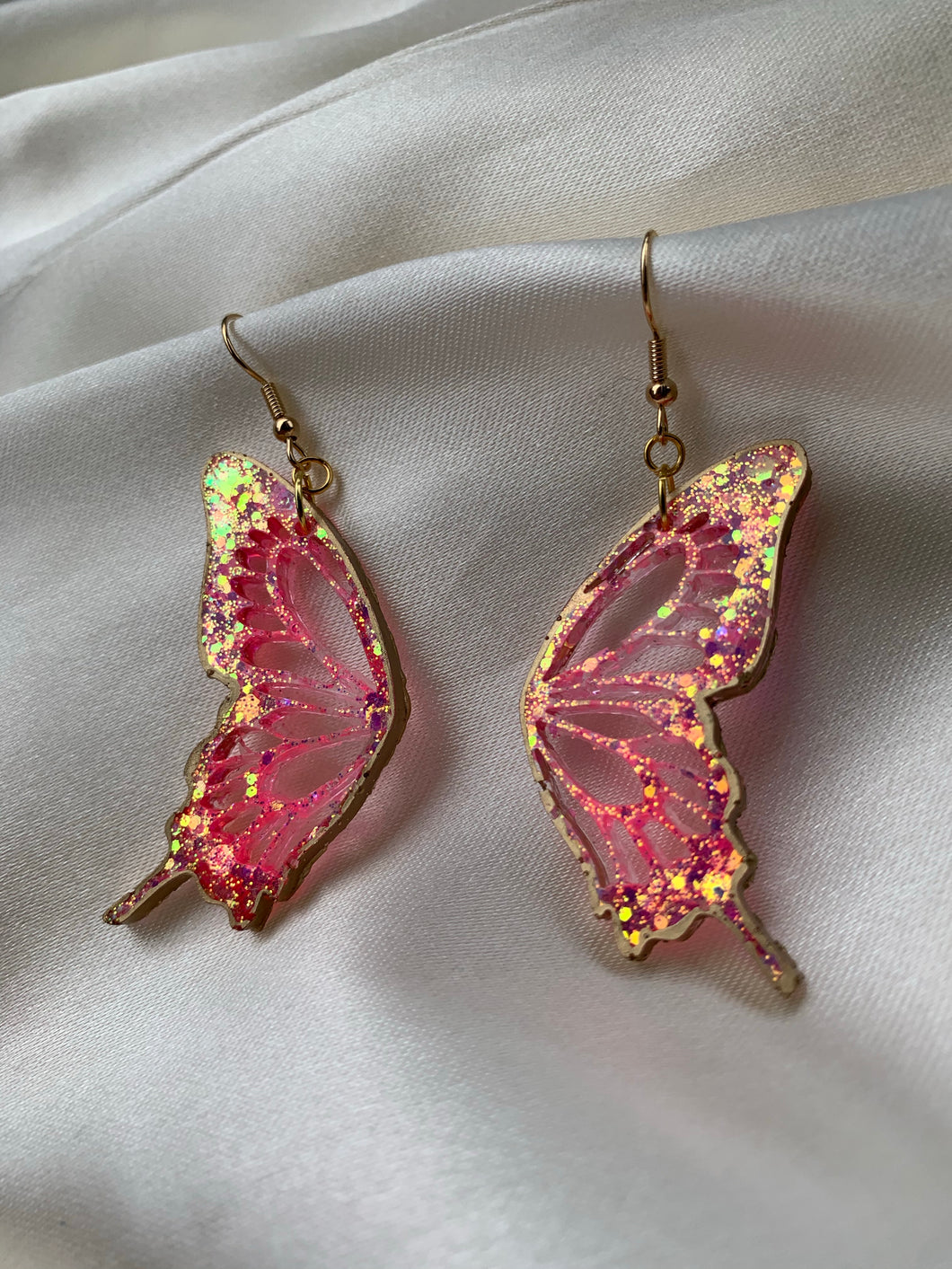 Pink butterfly earrings lined in gold