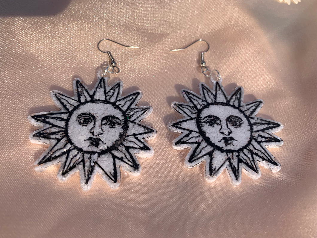 White sun face earrings