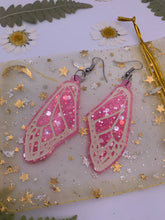 Load image into Gallery viewer, Pink glow in the dark wing earrings
